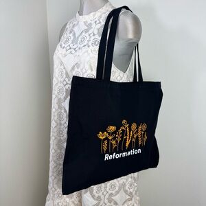 REFORMATION Canvas Tote Bag in Black With White Graphic Print & Wild Flowers
